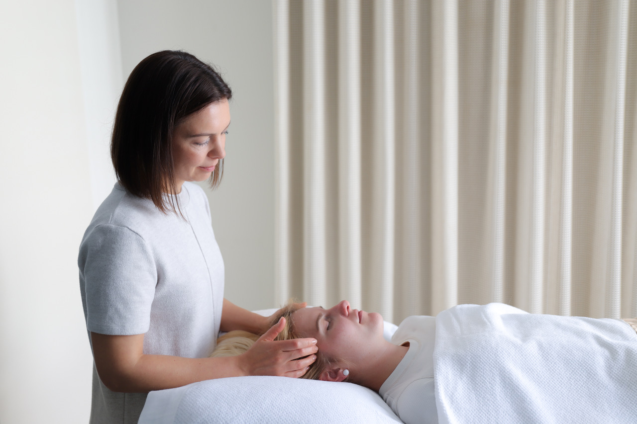 Tatiana providing a gentle acupressure treatment